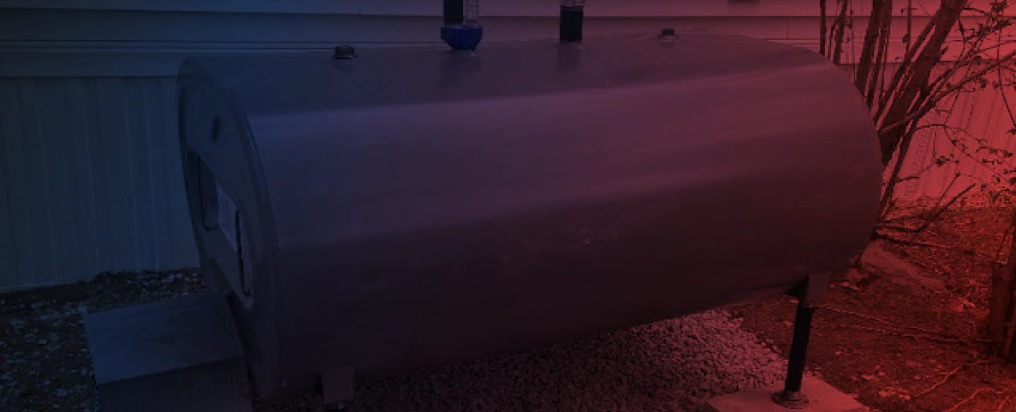 oil container colored grey outside of a house